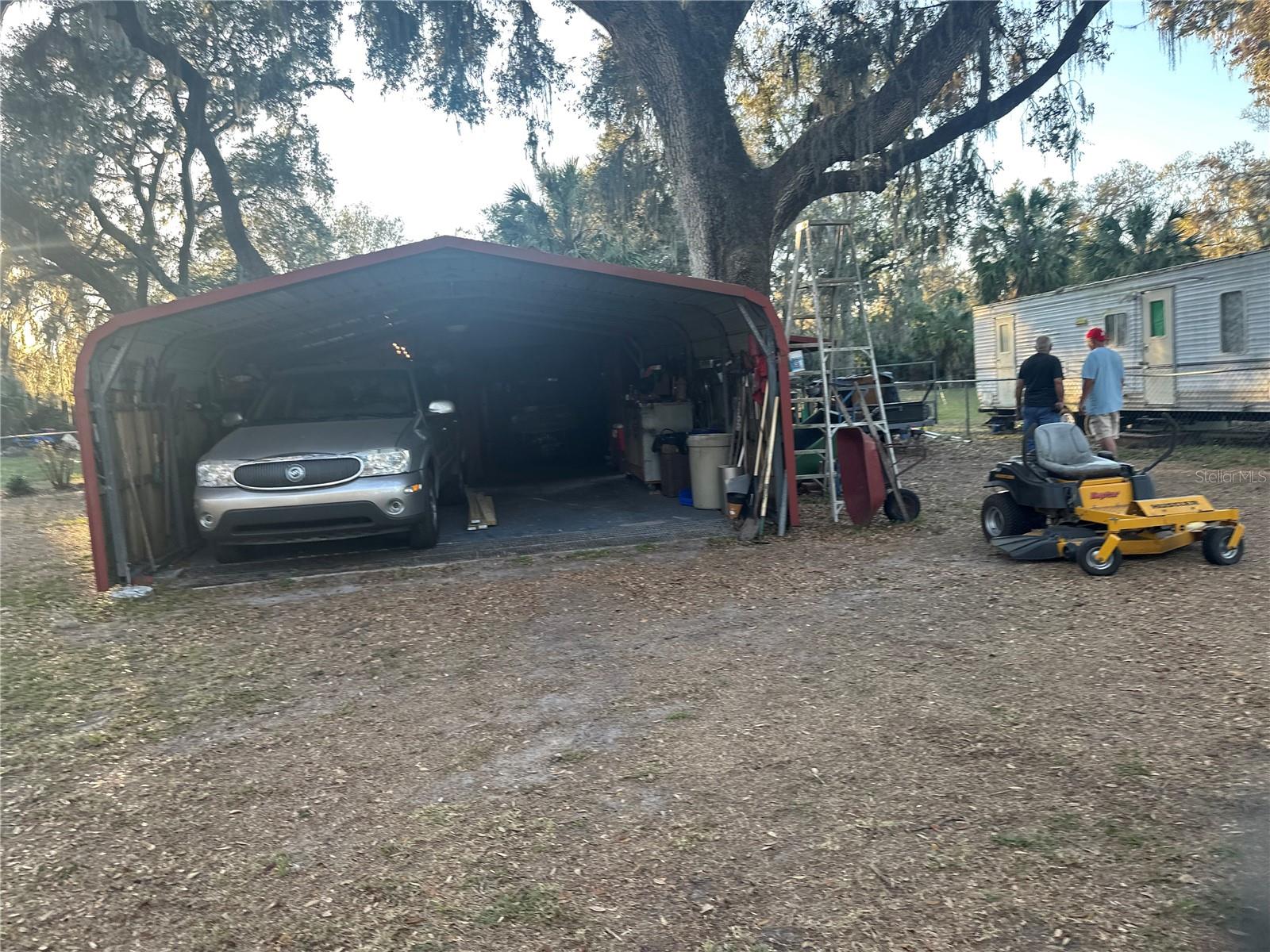 workshop with 2 car carport