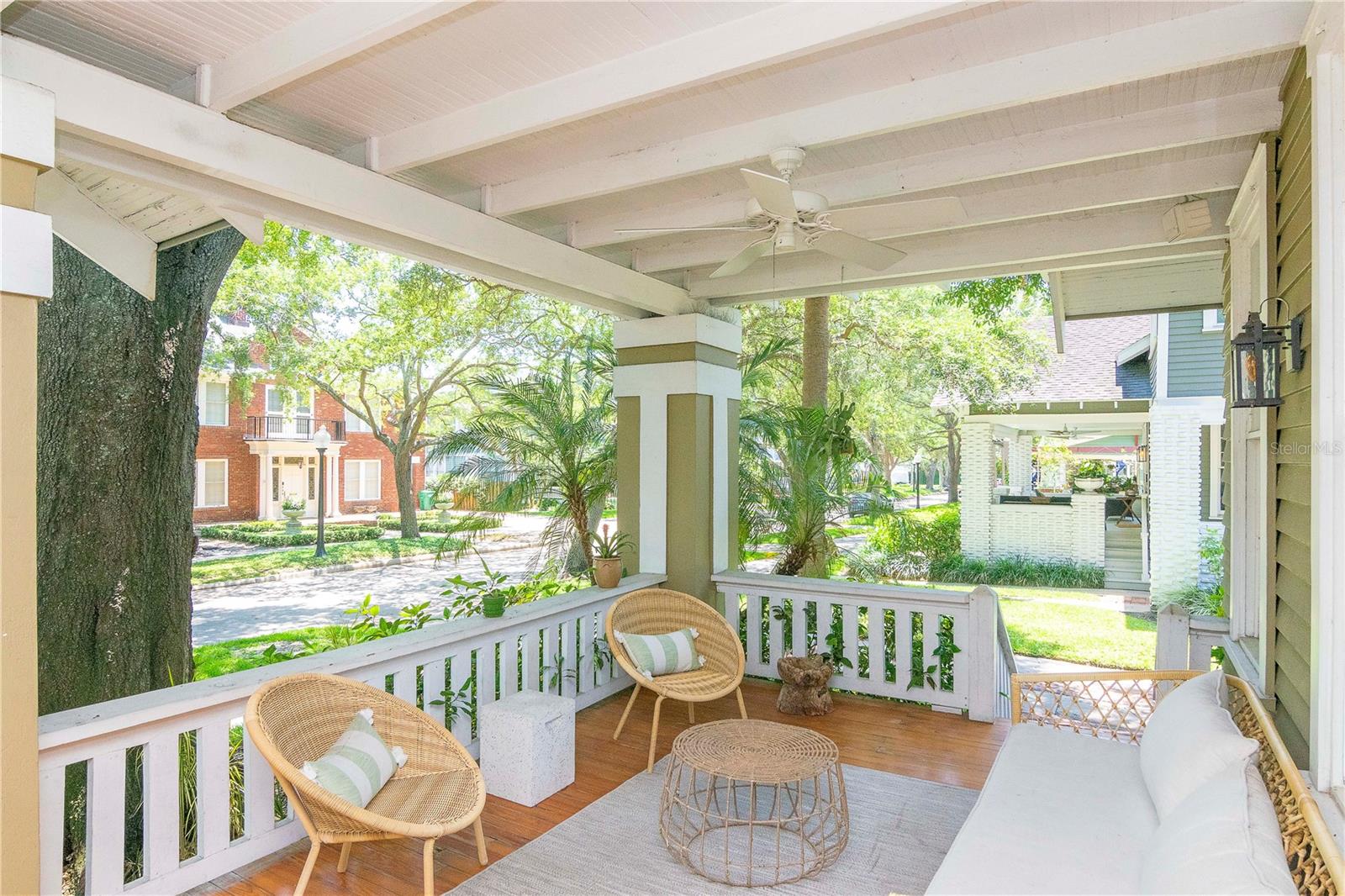You are greeted with a beautiful covered front porch featuring newly refinished heart of pine floors...the perfect outdoor living space to enjoy the beautiful Florida weather and gather with friends.
