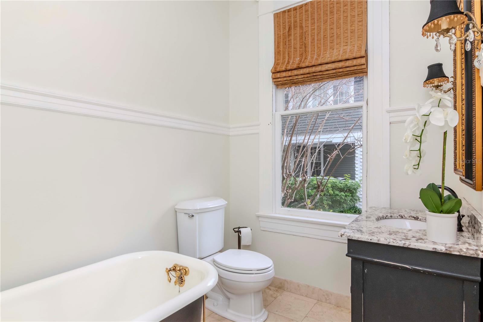 Charming hall bath with claw foot tub located just off of the 5th bedroom.