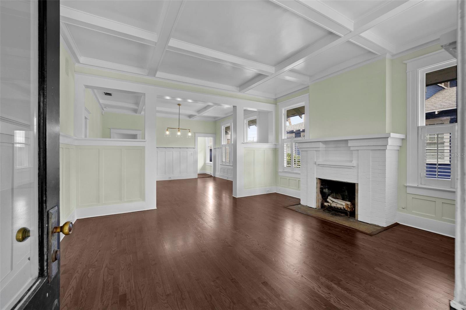 Notice the exquisite craftsmanship of a bygone era - high ceilings, beautifully refinished wood flooring, detailed mouldings, and architectural beams throughout.