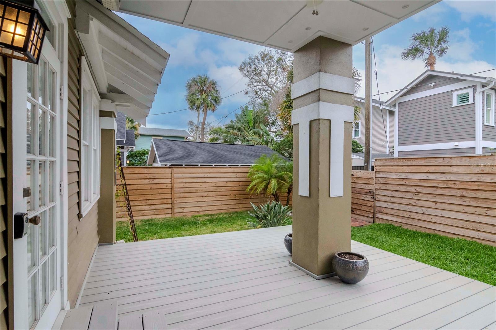 Notice the trex decking, newly installed landscaping and attractive wood fence (installed 2022).