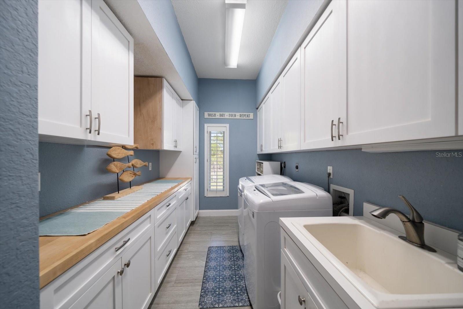 Very spacious laundry room. Upper cabinets on left are 15" deep, to accommodate large platters etc.