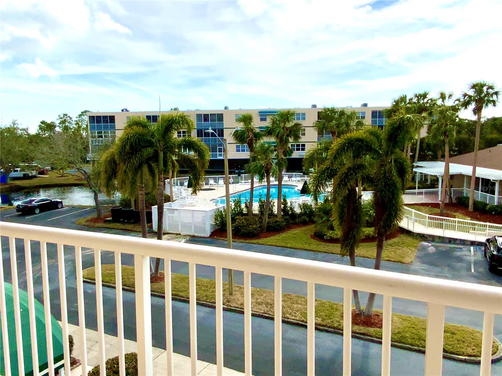 view of the pool from the front door
