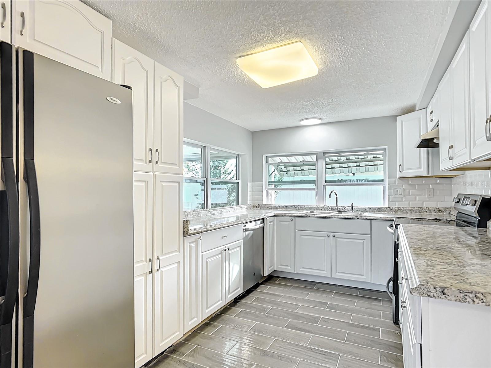 remodeled kitchen with SS appliances.