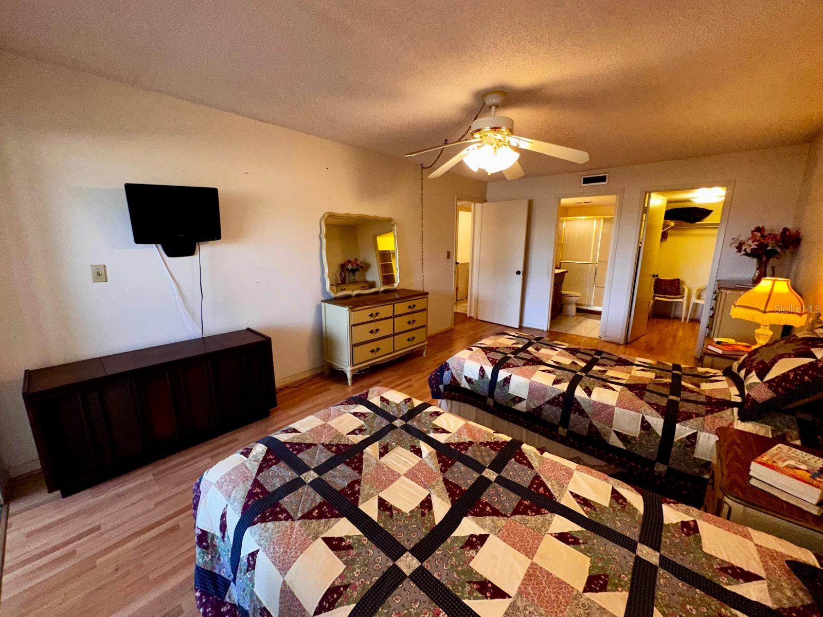 Master Bedroom showing ensuite bathroom and walk-in closet