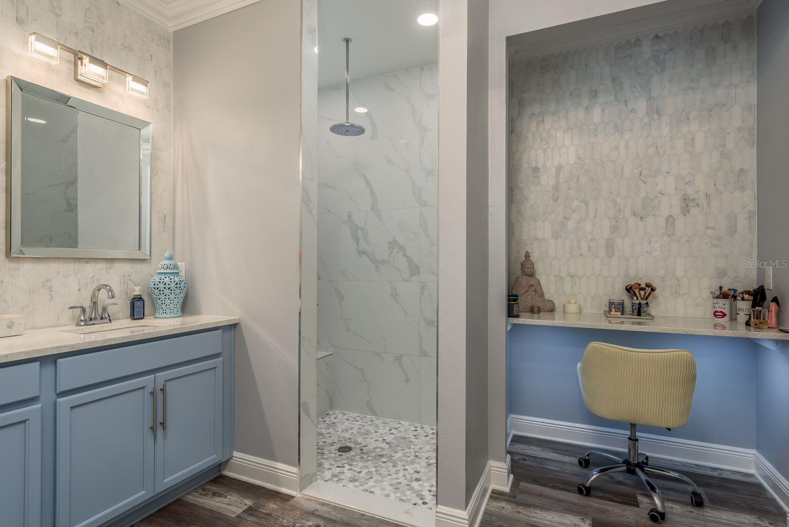 Vanity nook with marble wall