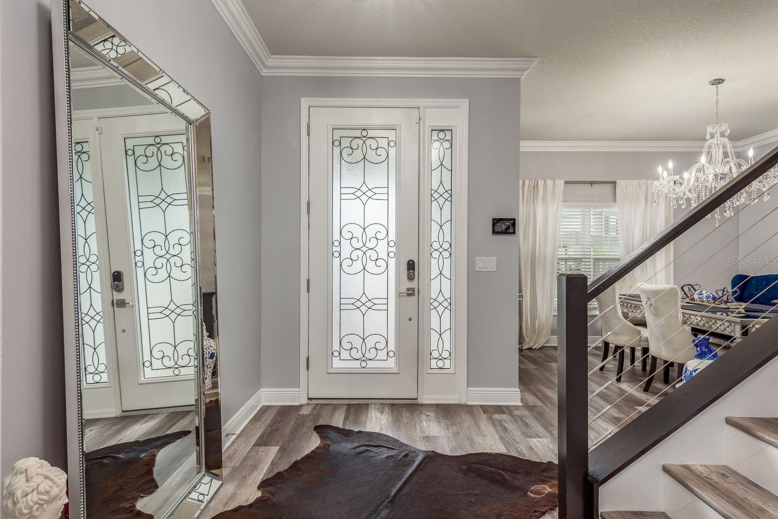 Glass door for extra light as you enter the home.