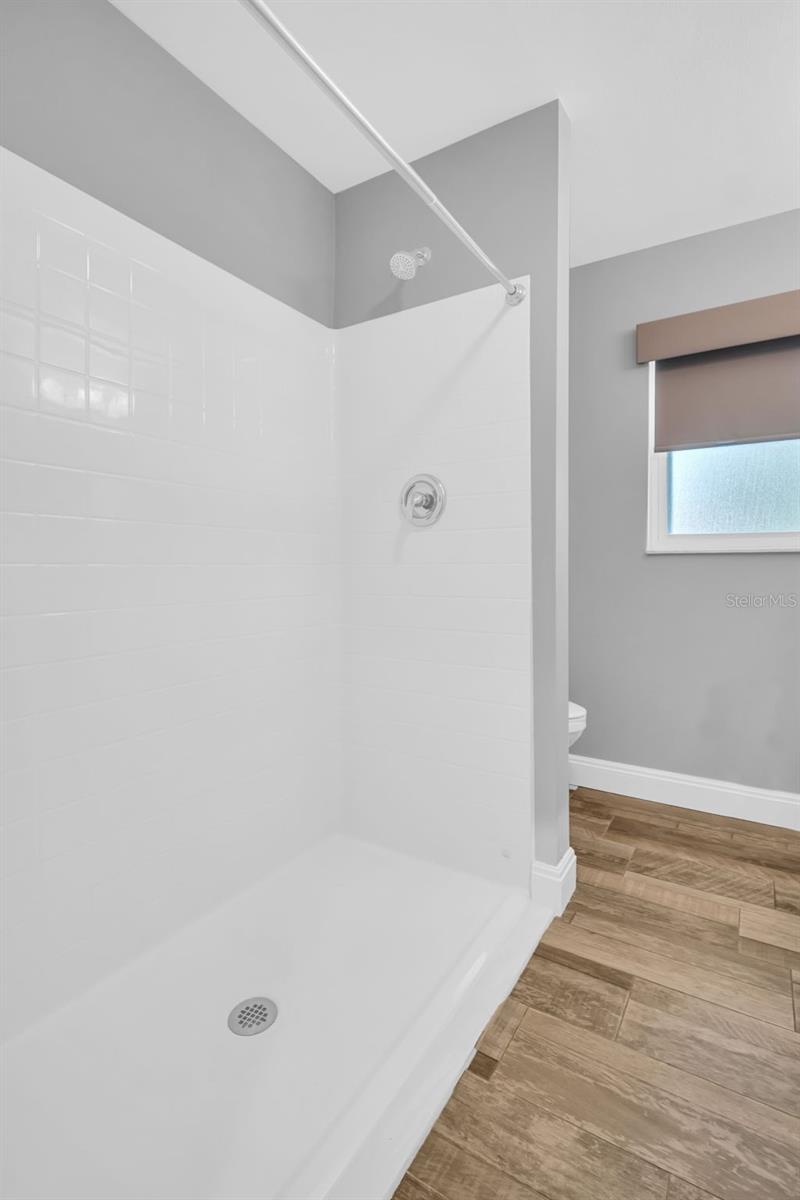 Beautifully updated hall bath with a large walk-in shower~