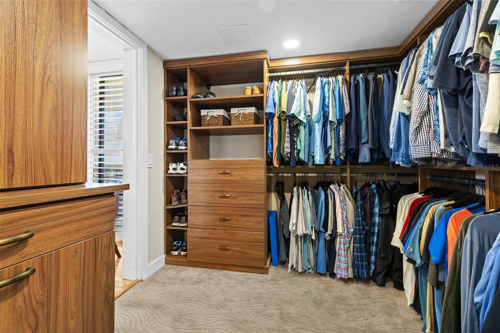 Walk in closet primary bedroom