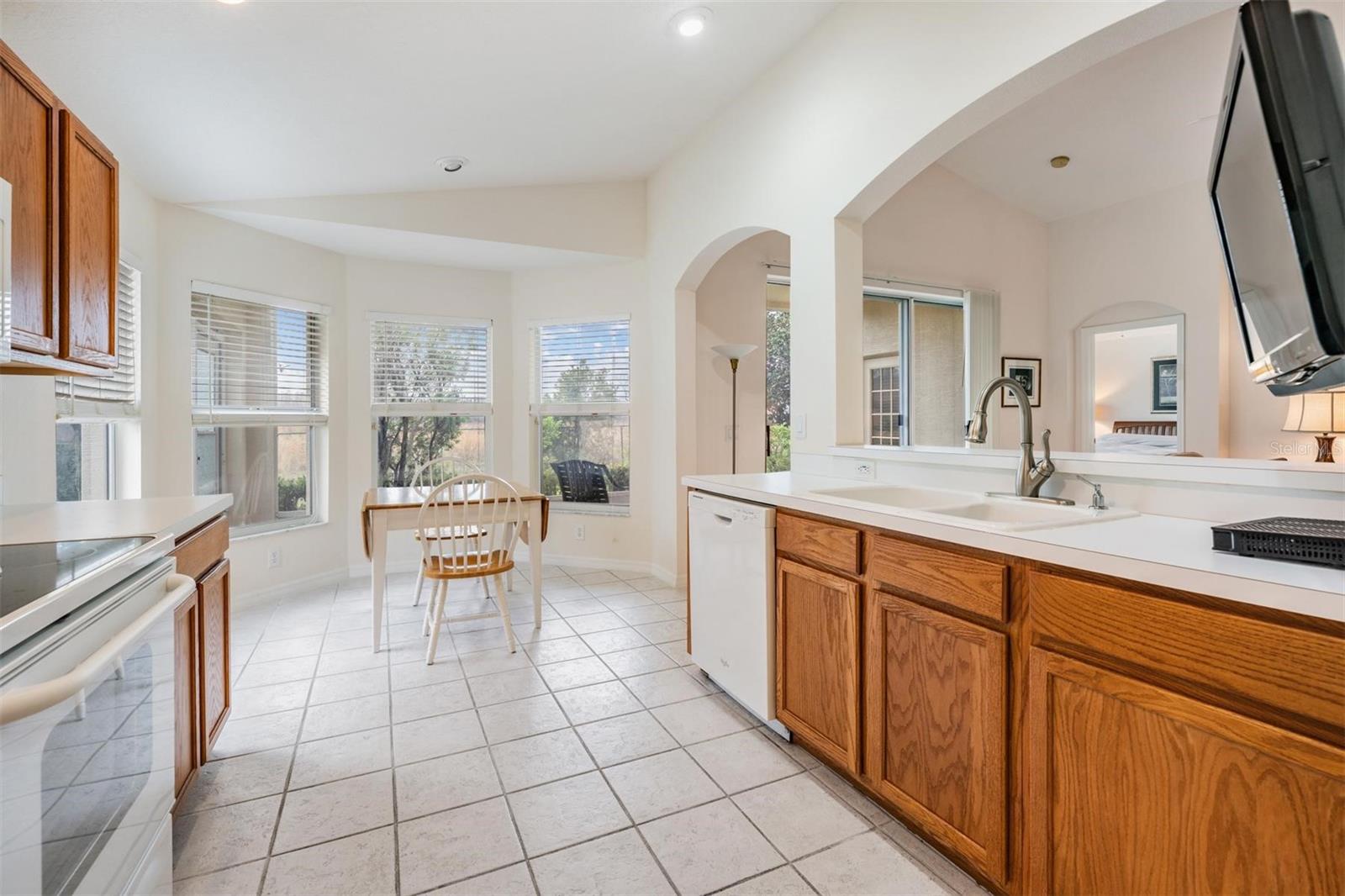 Bright kitchen with nook opens to great room