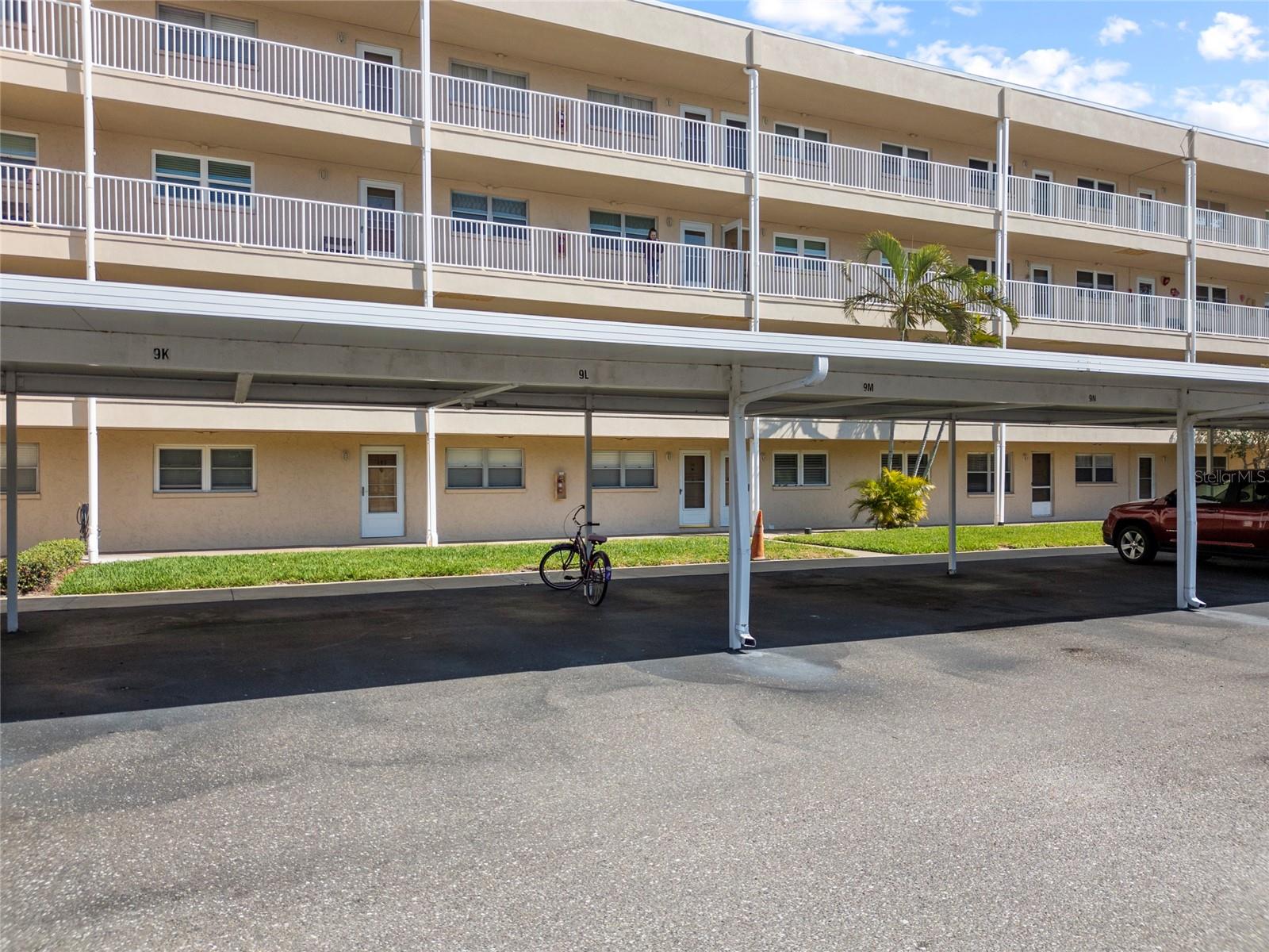 Building Exterior and covered parking space in front of the unit.