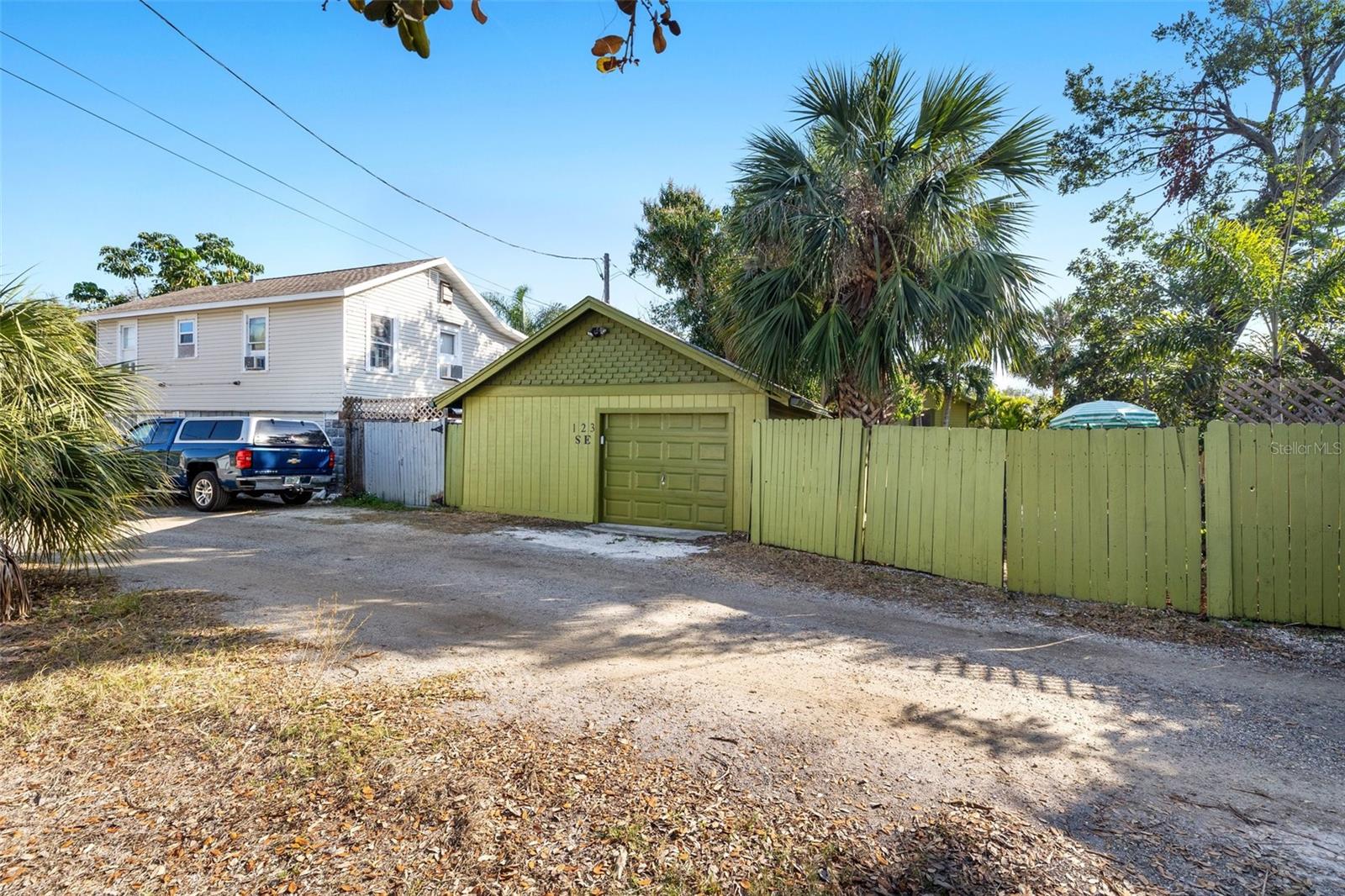 alley view, free standing 2 bay garage, 1 door