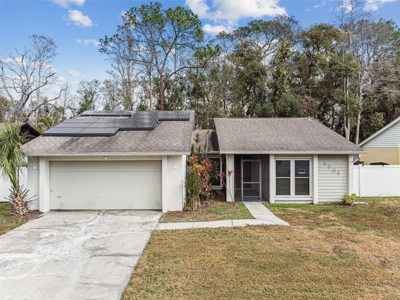 Aerial view of front w/solar panels