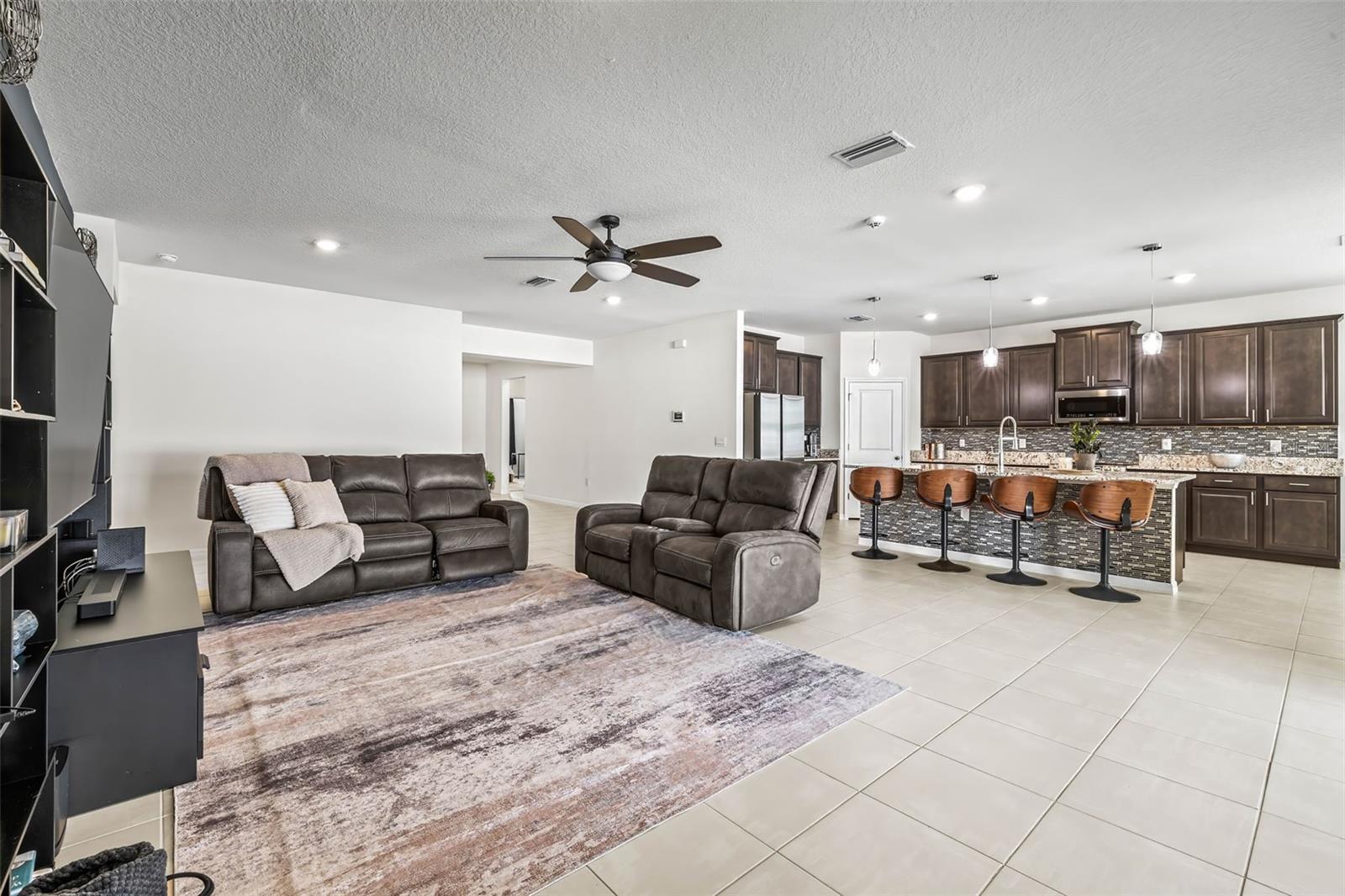 The main living area at the center of the home is HUGE- no shortage of space for your entertainment center.