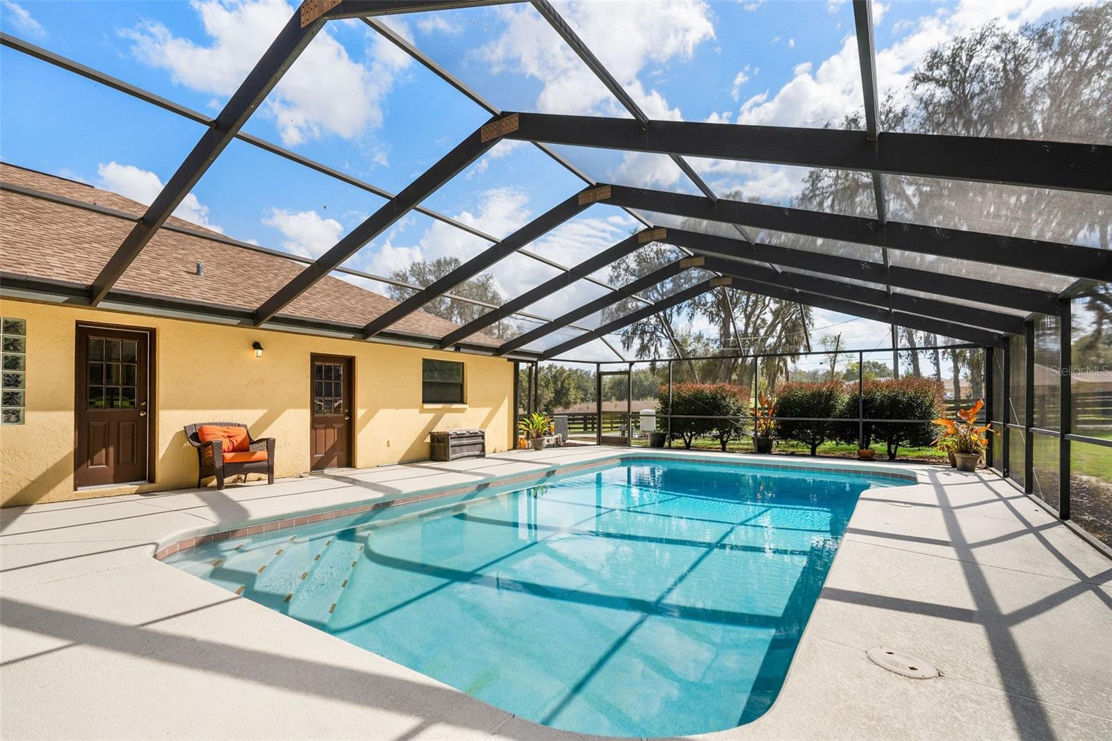 Large screened pool lanai with heated pool