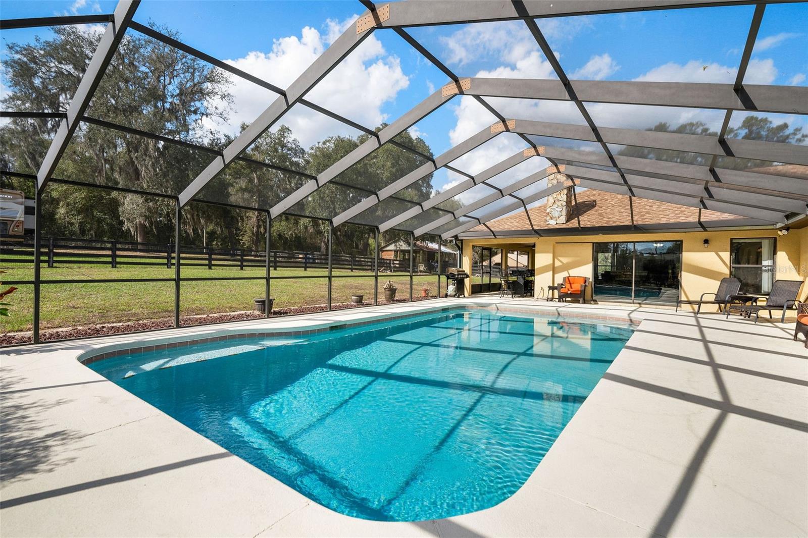 Large screened pool lanai with heated pool