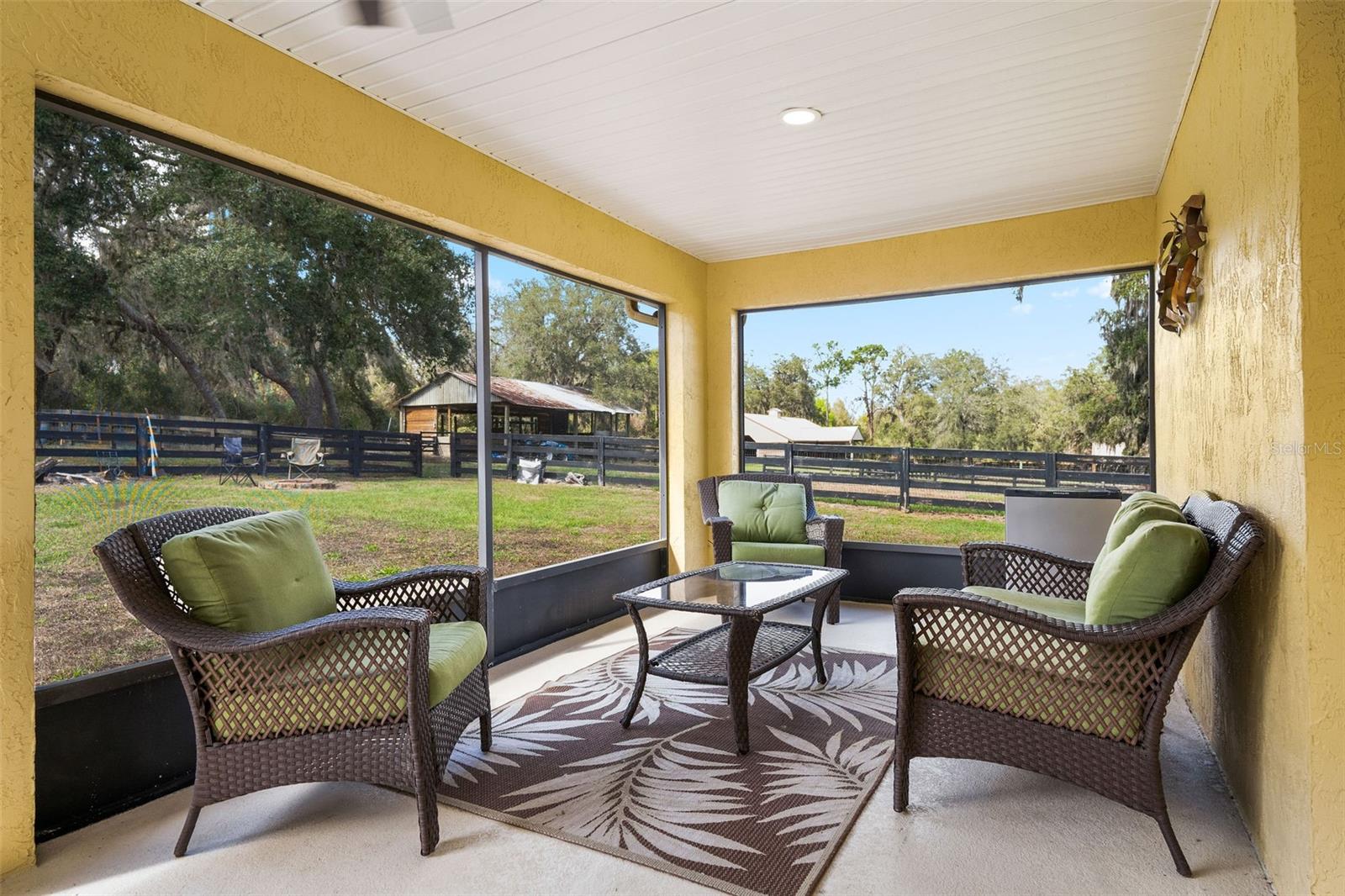 Covered, Screened area adjacent to pool