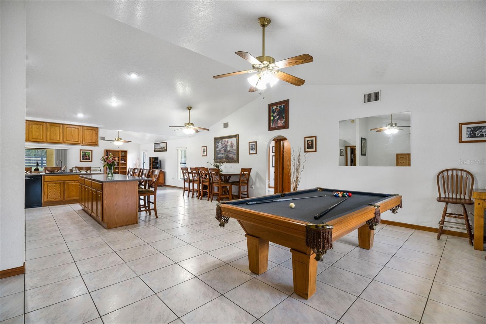 Huge open floor plan. Pool table is situated in the front living room