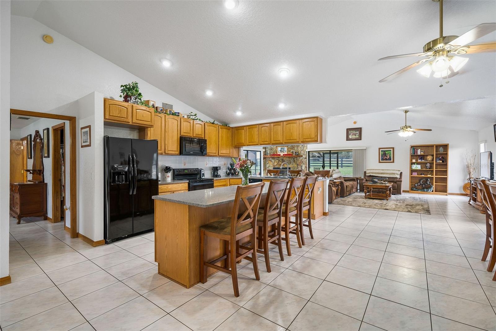 Tons of wood cabinetry &  solid stone countertops