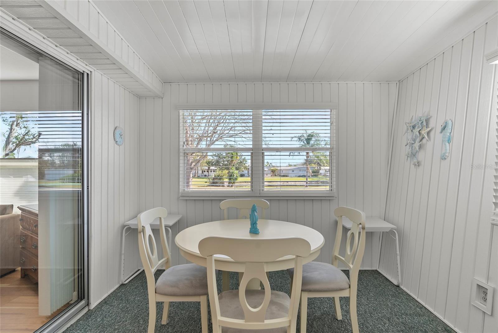 SUNROOM EATING AREA WITH A VIEW