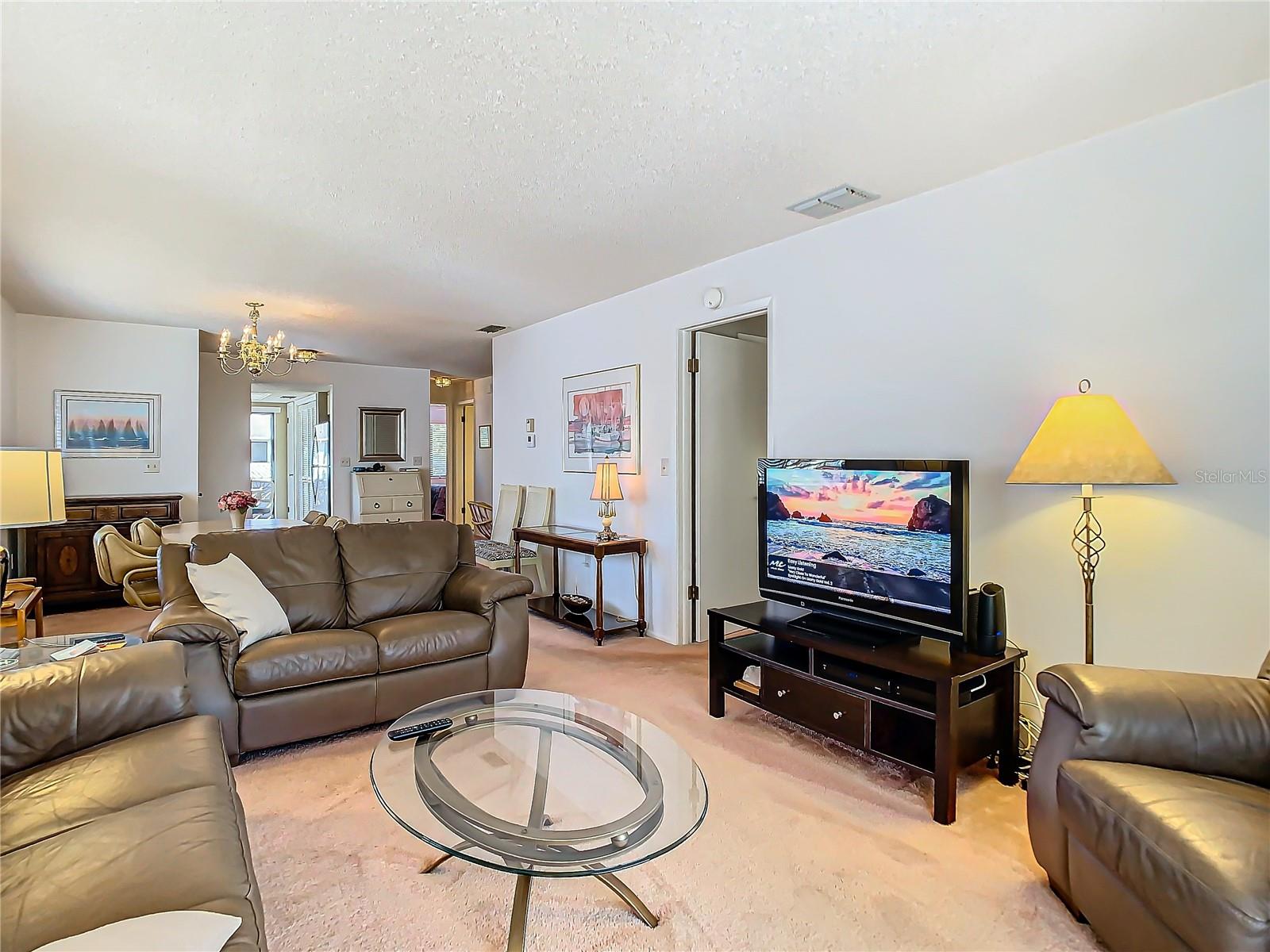 Living room towards kitchen and dining area