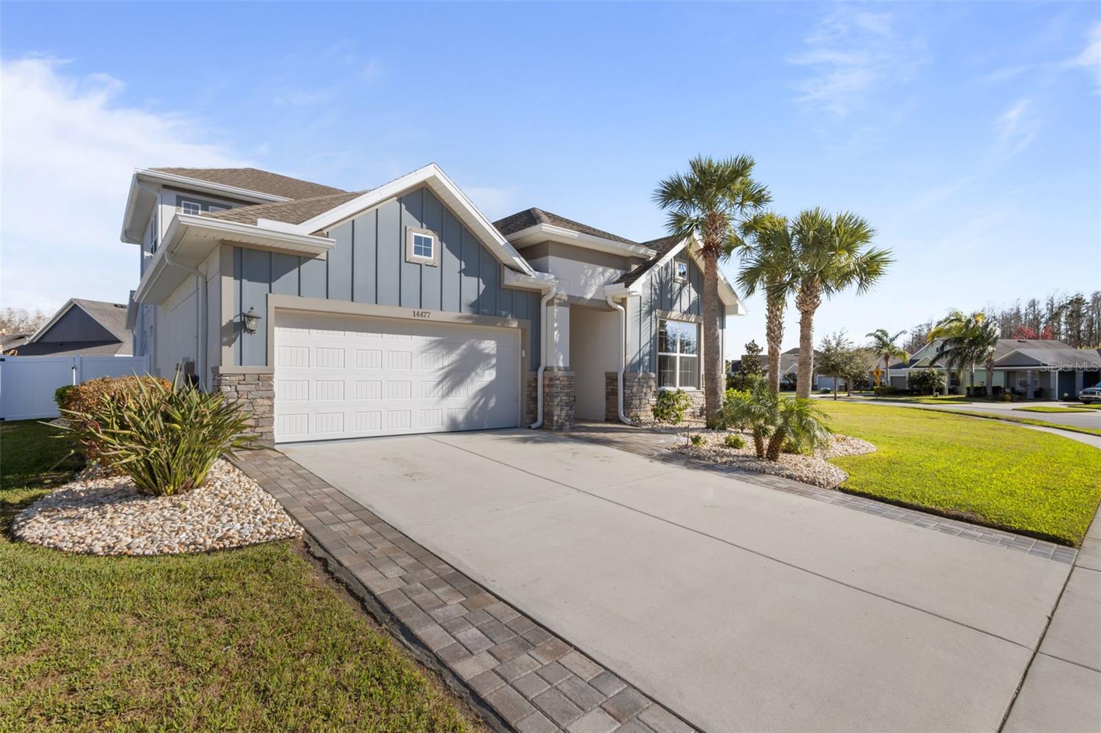 Exterior -  tropical landscaping, extra pavers on driveway increasing driveway width and appearance