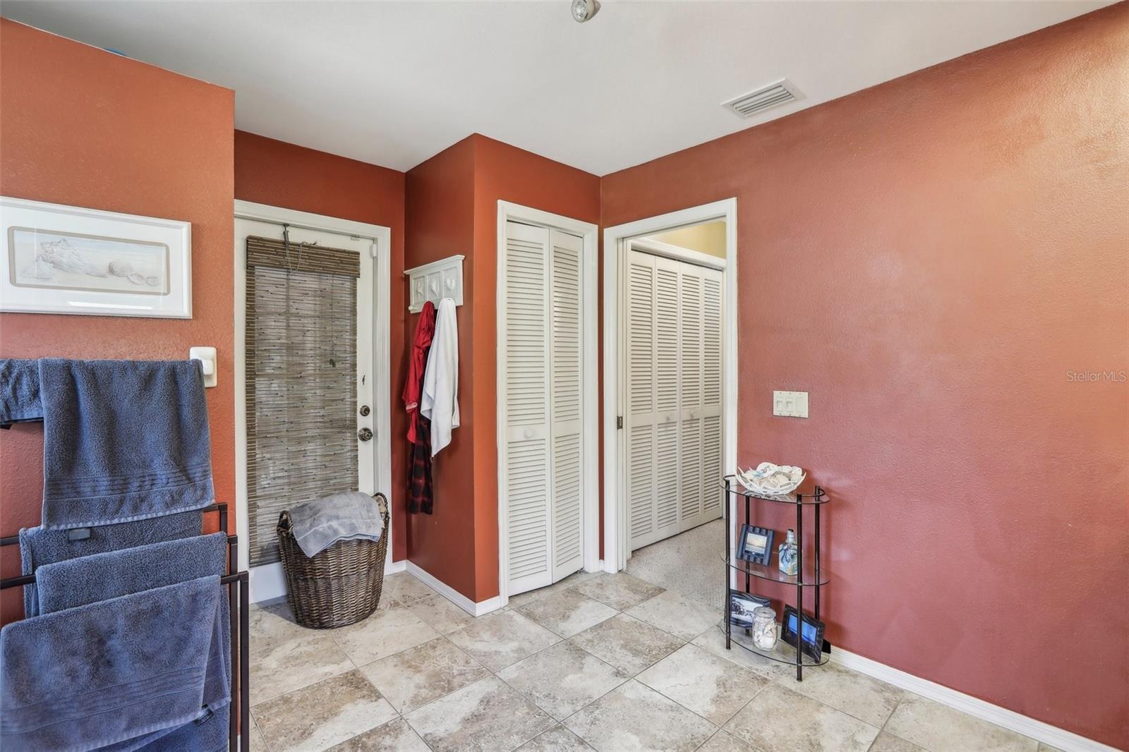 Linen closet, door to lanai and door to primary bedroom