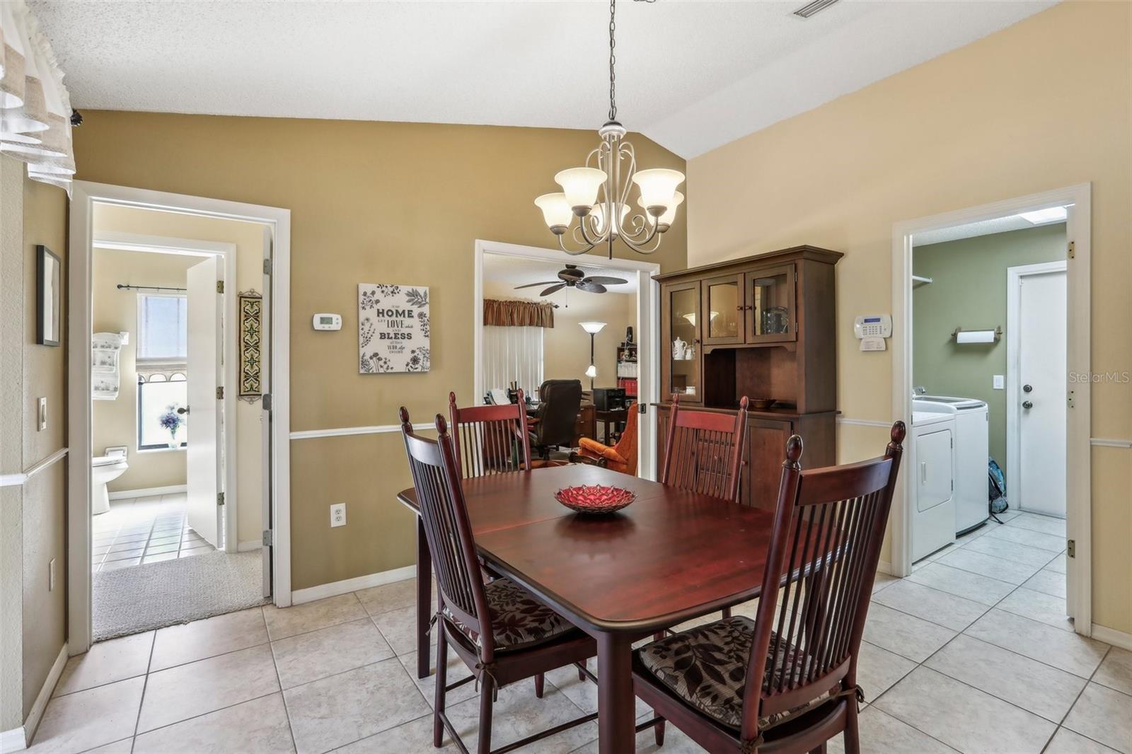 Dining room, bath 2 to left, bedroom 2 ahead and laundry room to right