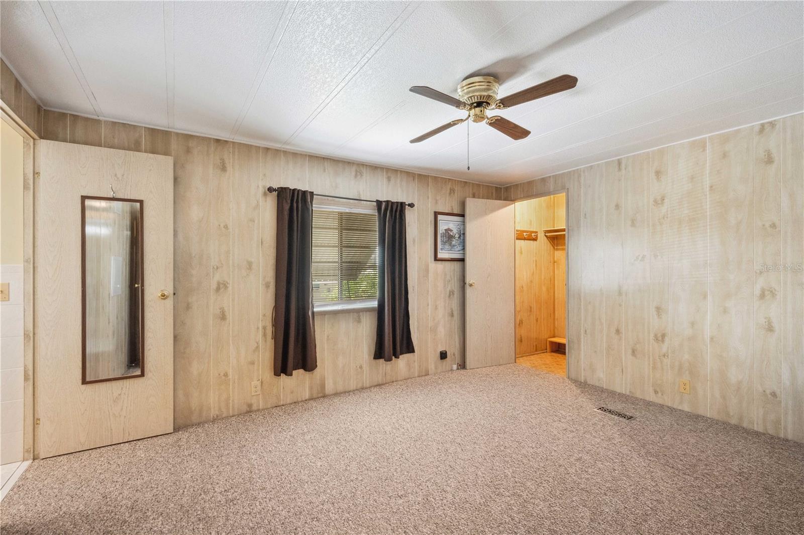 Large primary bedroom with walk-in closet.