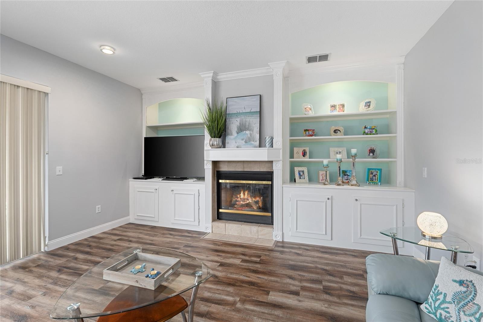 Family room with custom built ins and a propane fireplace