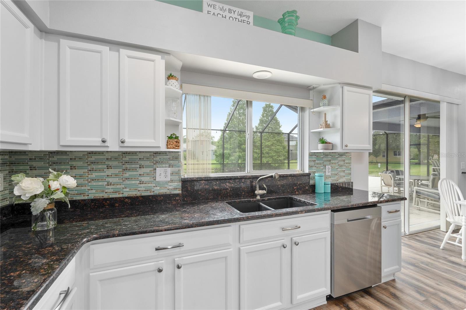 Love that the kitchen sink has a view of the pool and back of the home