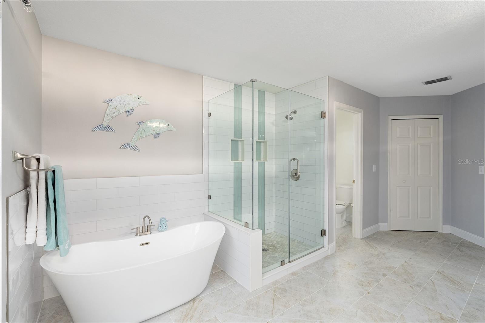 Soak the stress of the day away in this Primary Bathroom with large tiled shower.