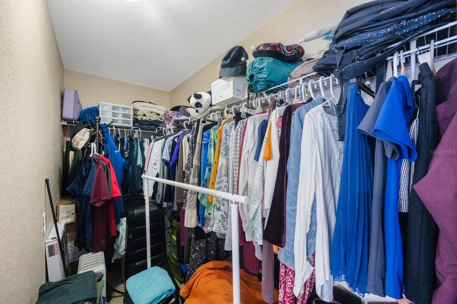 huge walk-in closet in master bedroom