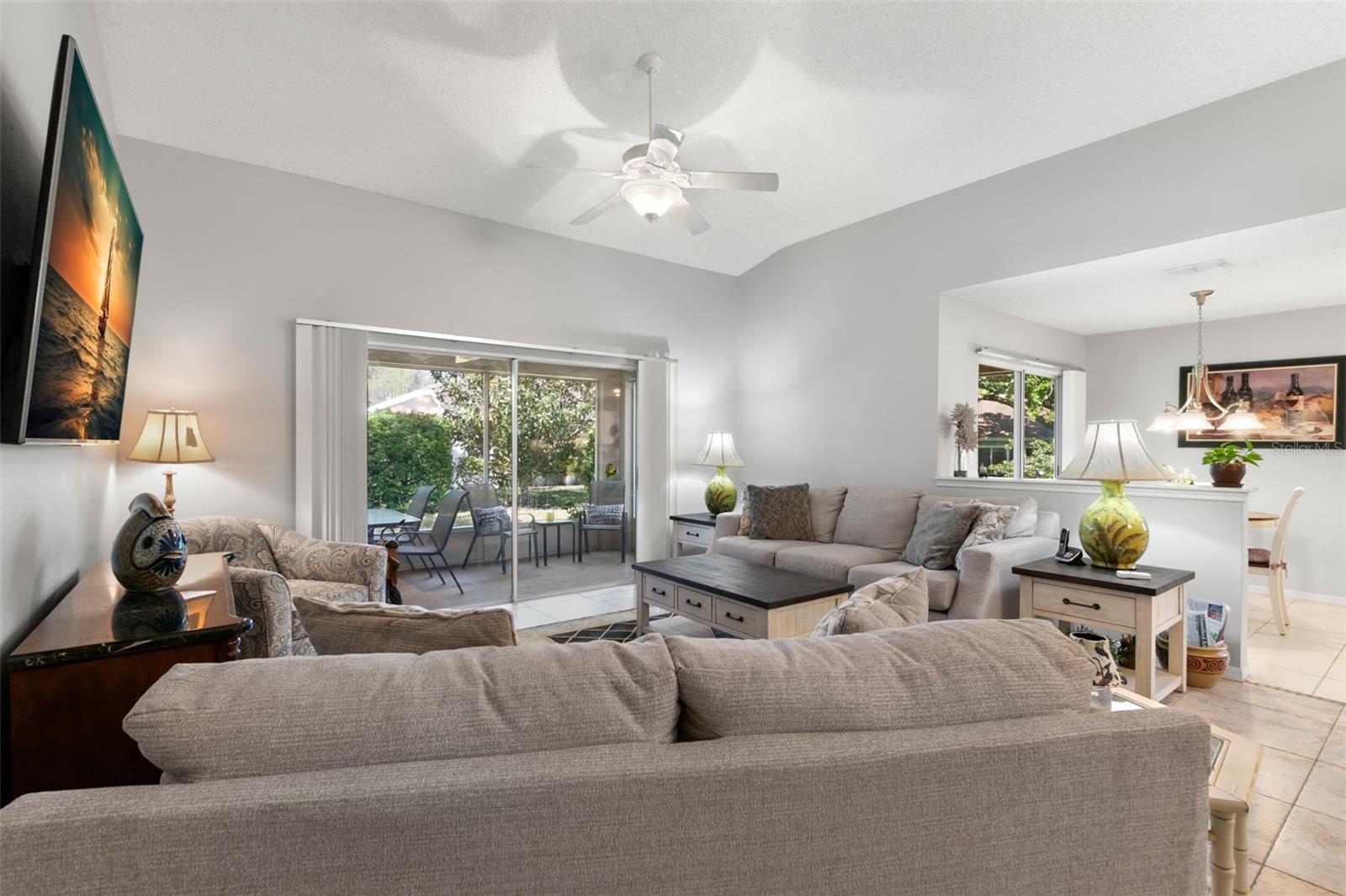 Living Room, One of Two Screened Lanais and Kitchen