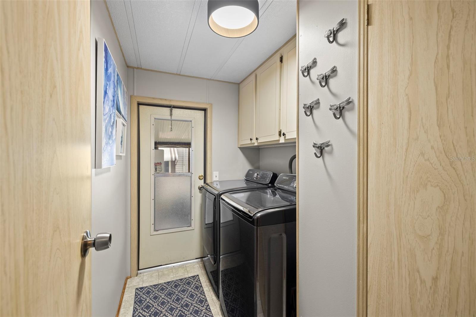 Inside laundry room with new washer & dryer