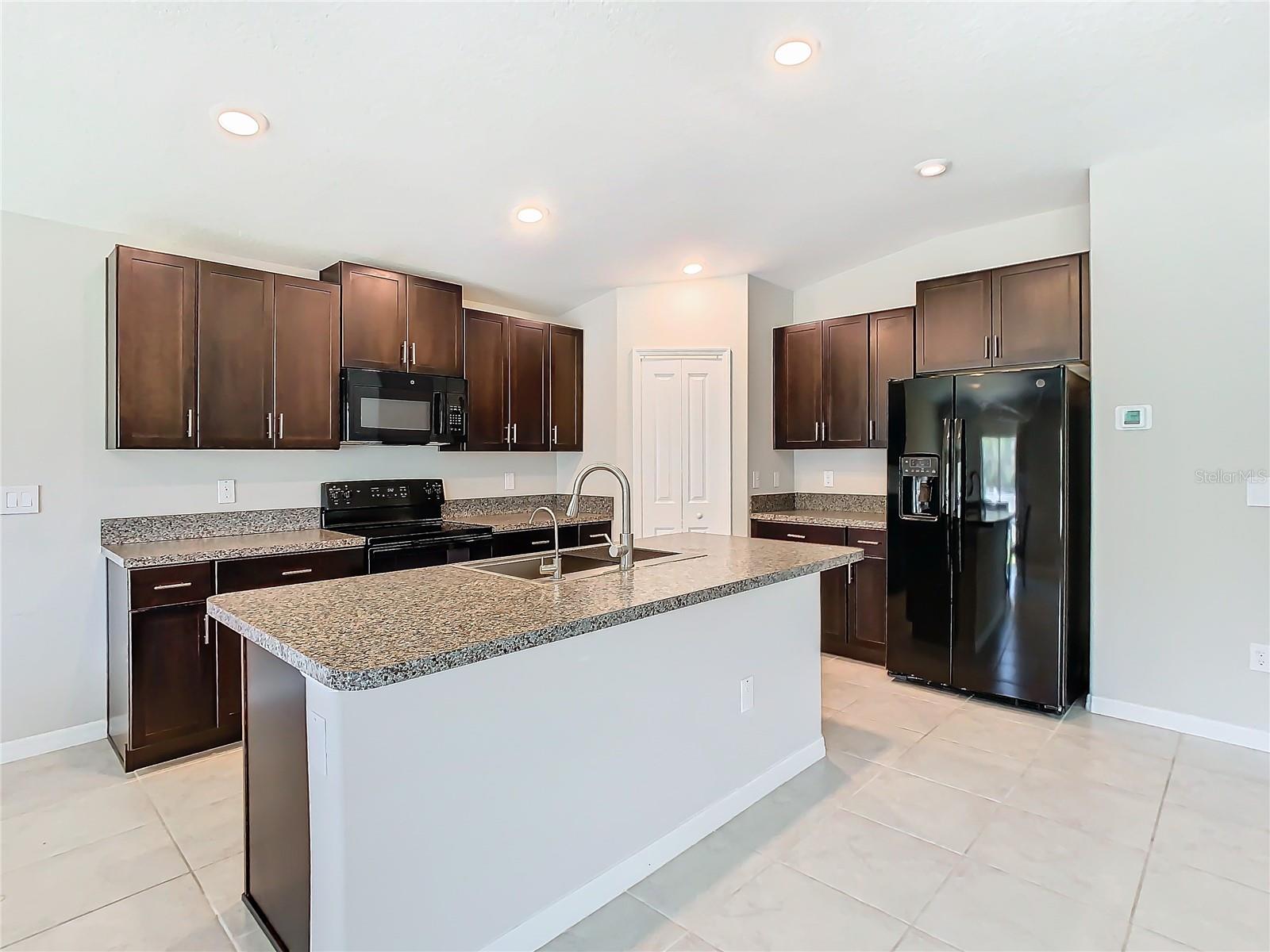 Perfectly Laid Out Kitchen Triangle Including Big Island & Walk In Pantry