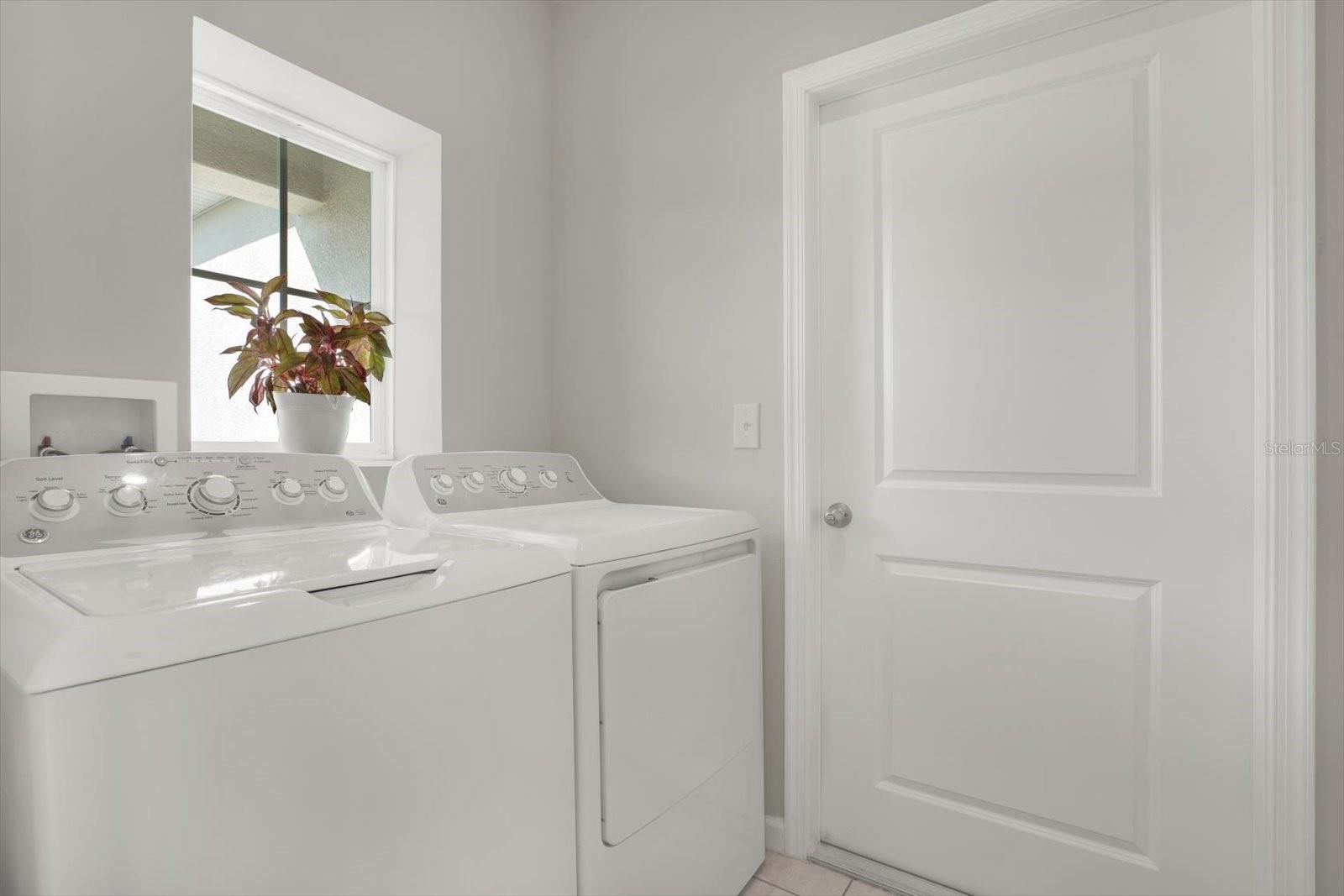 Indoor laundry room with washer and dryer