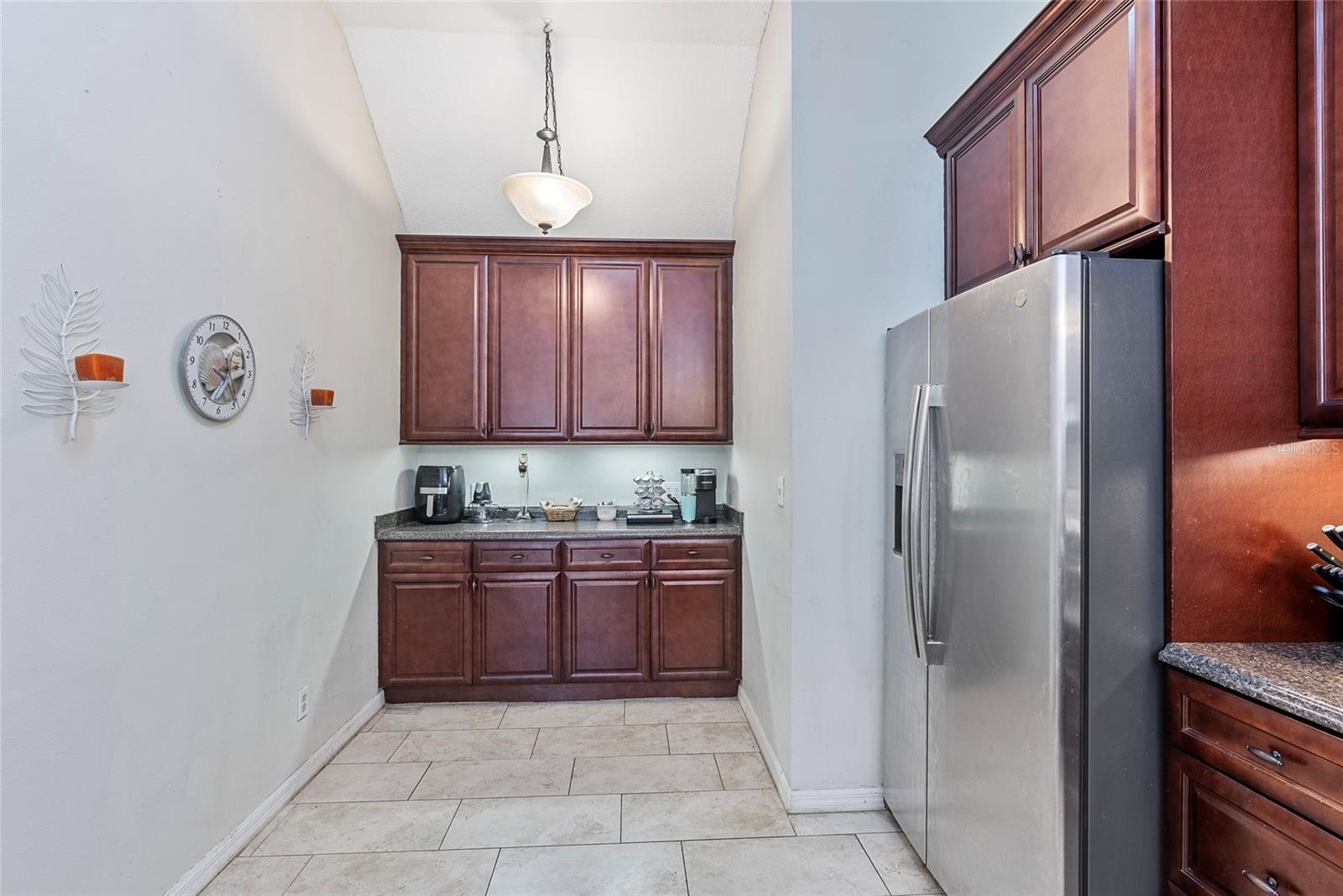 The additional cabinets at the back of the kitchen make for the perfect space for a coffee station or dry bar.