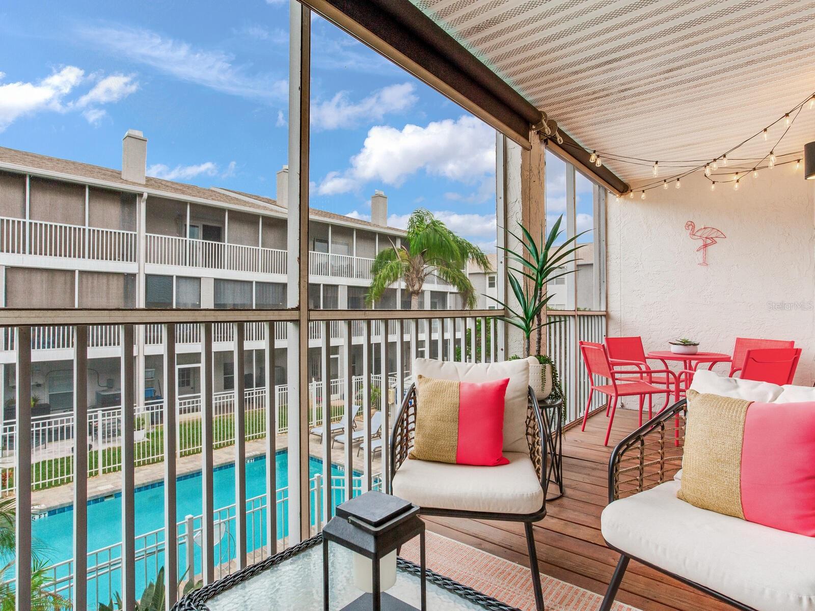 Lanai over looking pool with solar roll down shades, directly off main living floor.