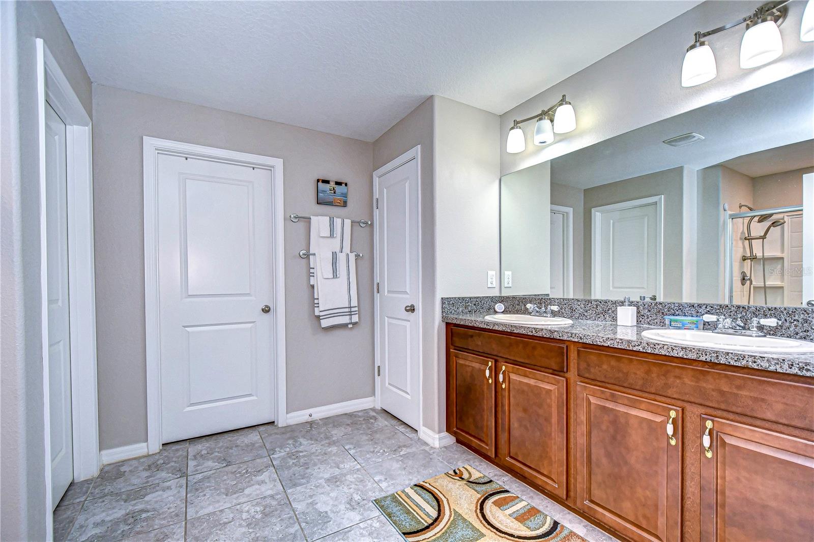 Primary bathroom with double vanity .