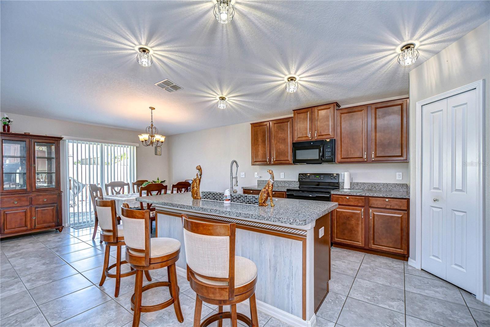 Bright kitchen with elegant lighting.