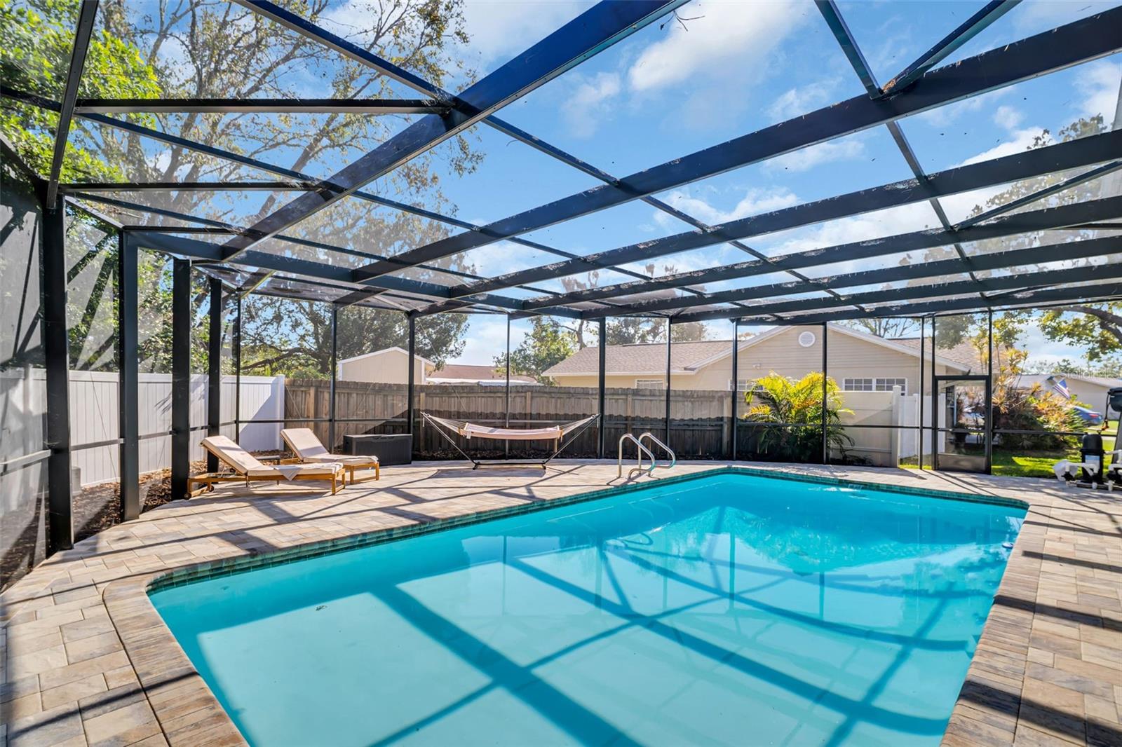 Pool with new cage and pavers!