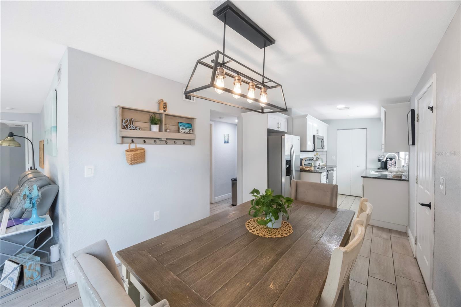 Dining room which allows you to be apart of conversation in the living room or kitchen