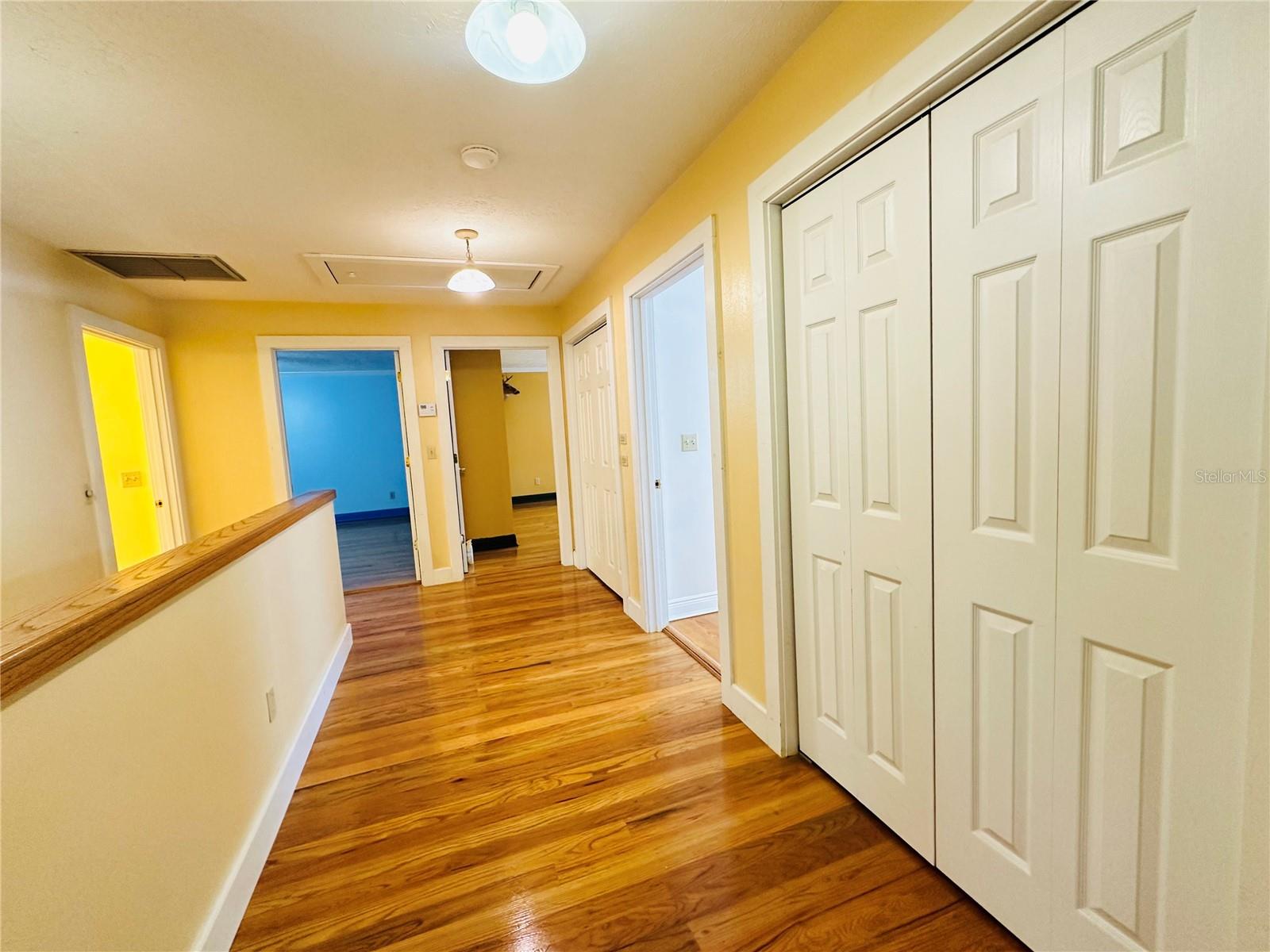 Hallway with plenty of storage closets