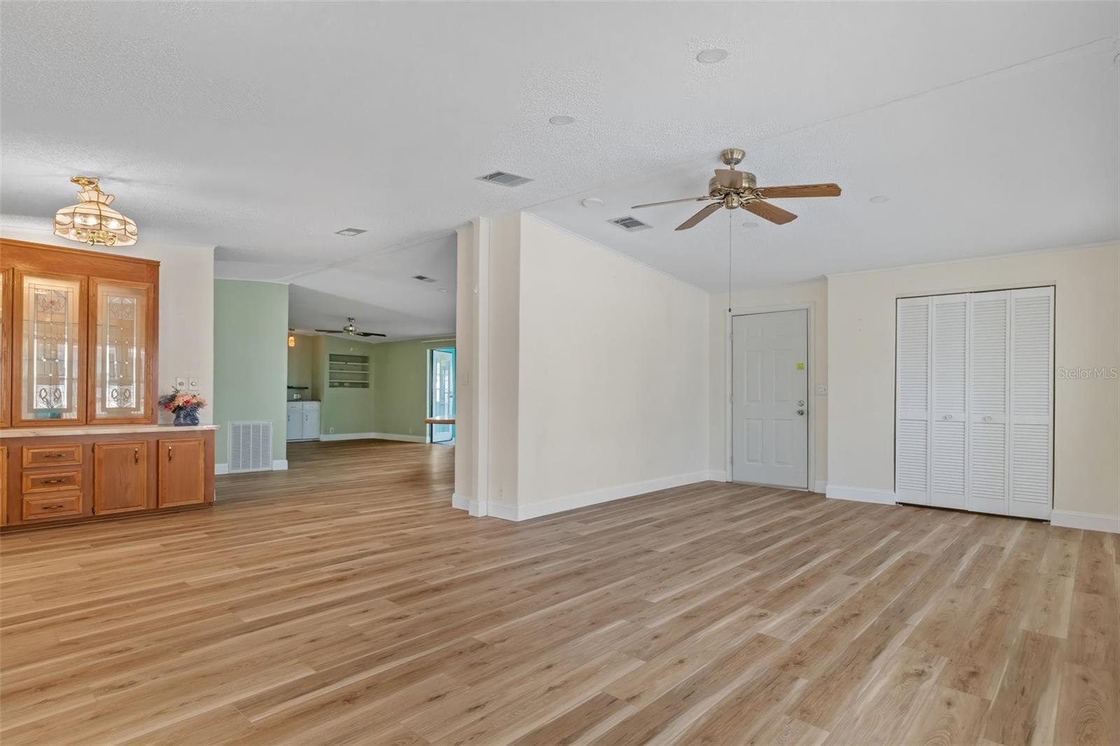 Dining, Kitchen and living room with exit to West side porch