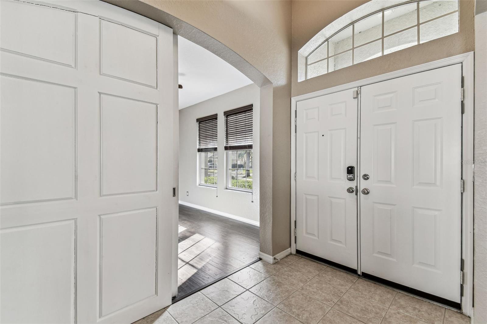 Upon entering, immediately to your right is an office/den with custom barn doors.