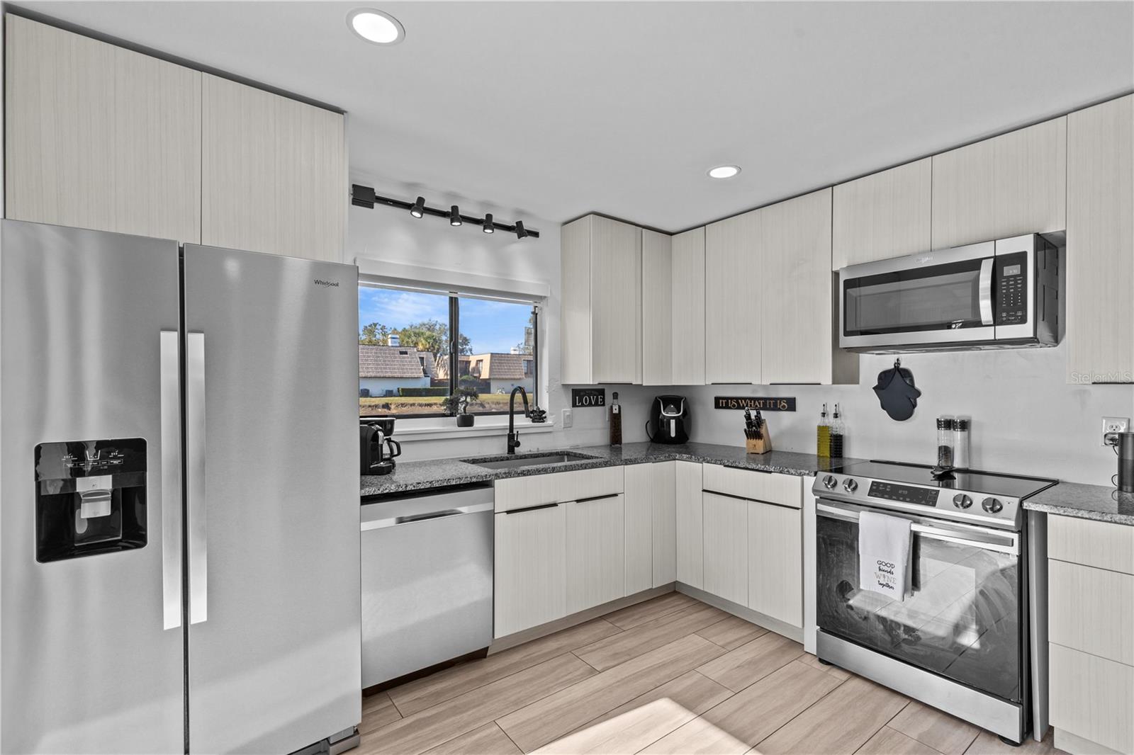 Kitchen with Window with View of Pond