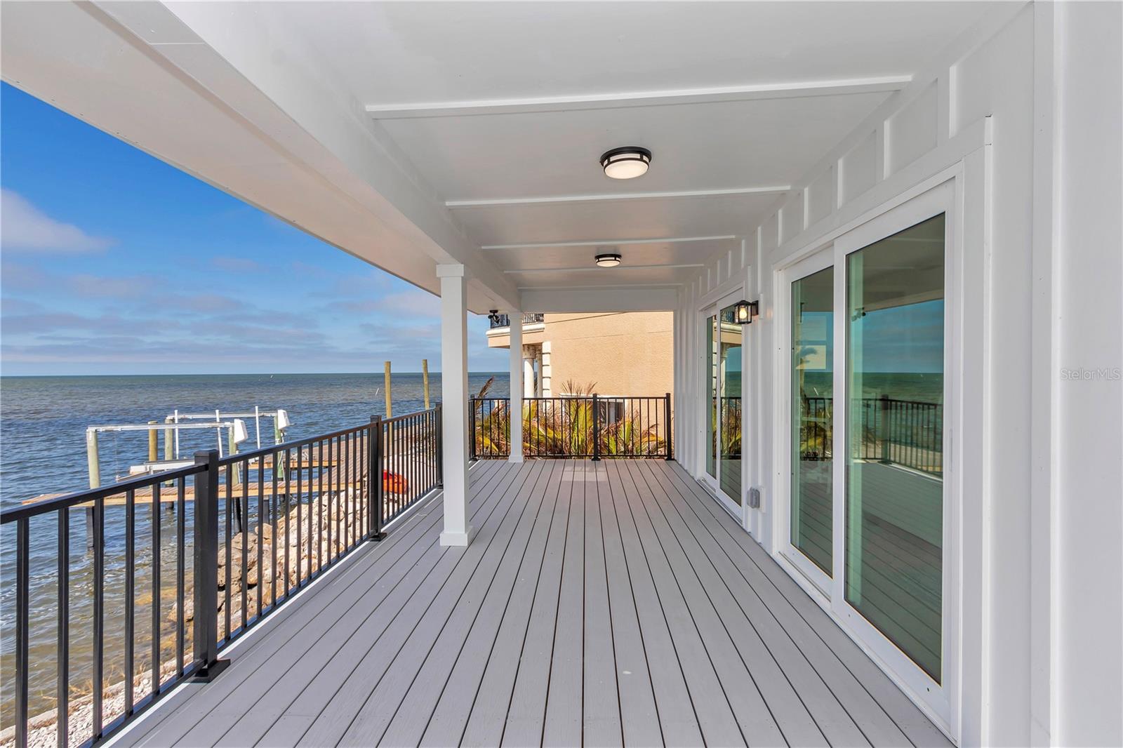 Back patio with porch and sliders to the home