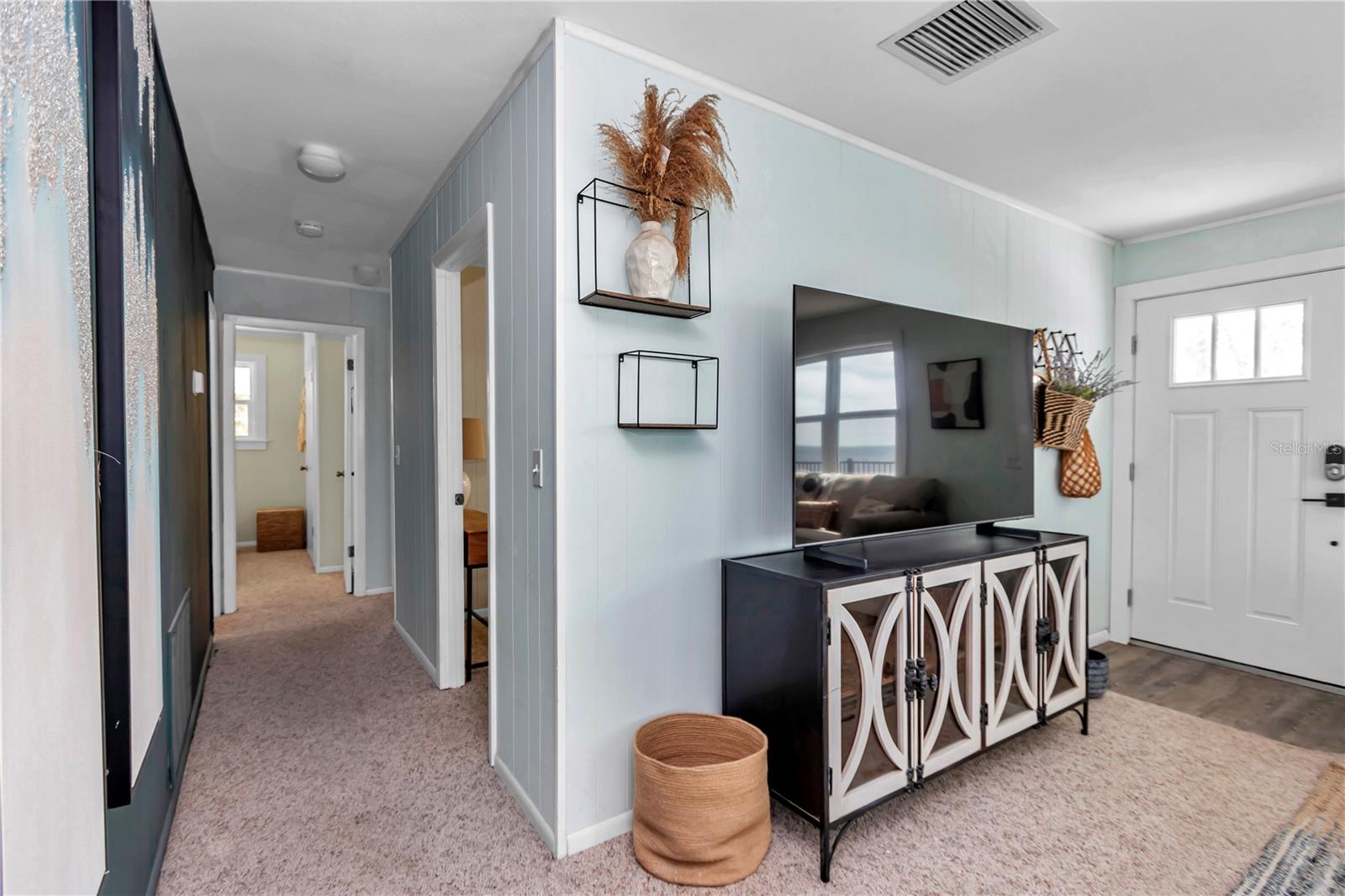 hallway to 3 bedrooms and bathroom