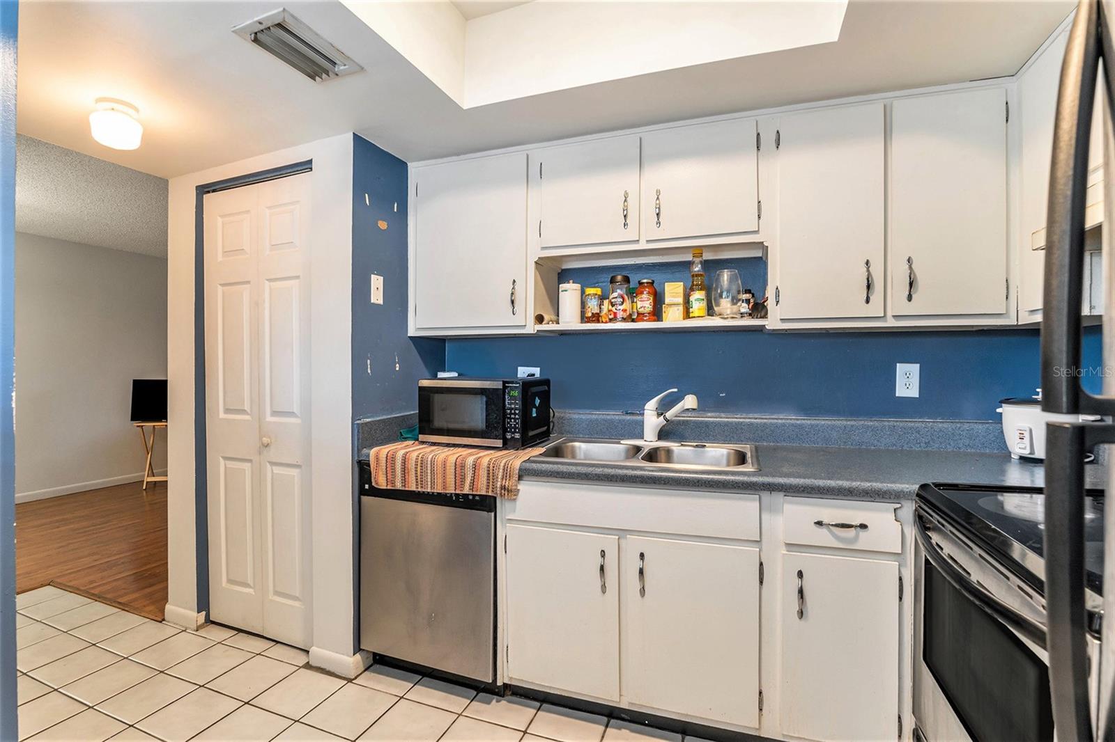 The kitchen boasts updated cabinets and stainless steel appliances.